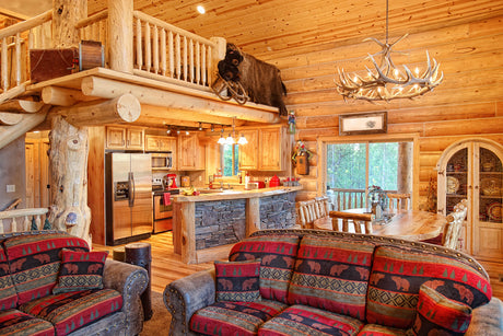 rustic cabin living room with an antler chandelier